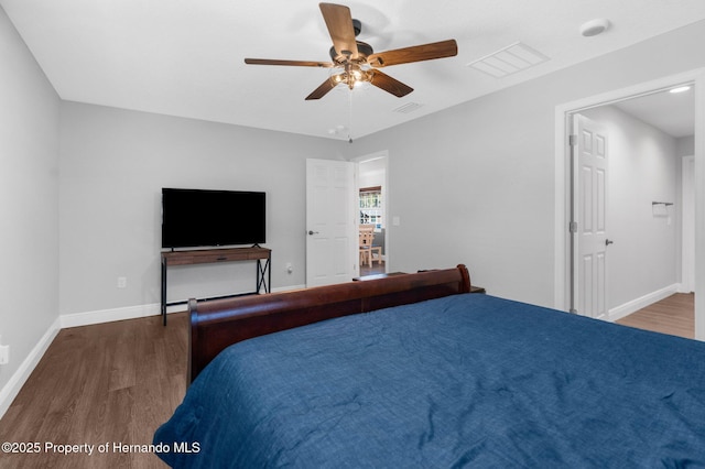 bedroom with hardwood / wood-style floors and ceiling fan