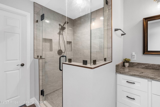 bathroom with vanity and an enclosed shower