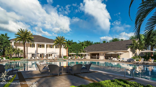 view of swimming pool with an outbuilding and a patio