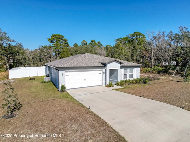 ranch-style house with a front lawn and a garage