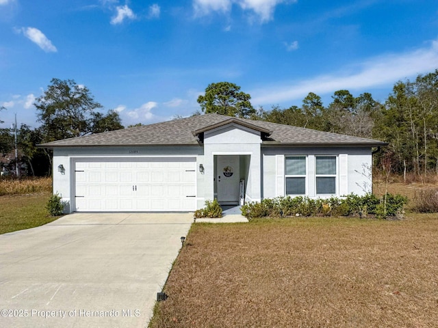 single story home with a front yard and a garage