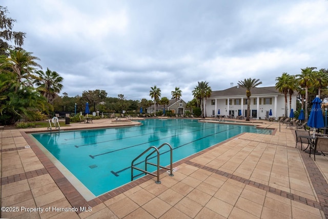 view of swimming pool featuring a patio