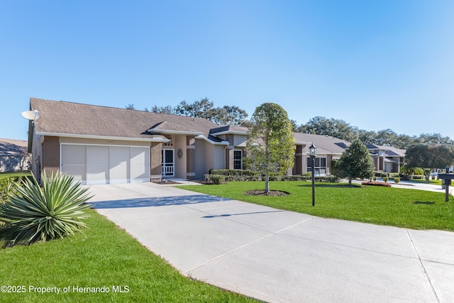 view of front facade featuring a front lawn and a garage