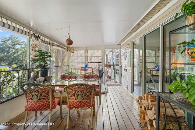 sunroom / solarium featuring a healthy amount of sunlight