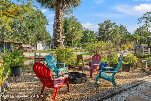 view of patio / terrace with an outdoor fire pit