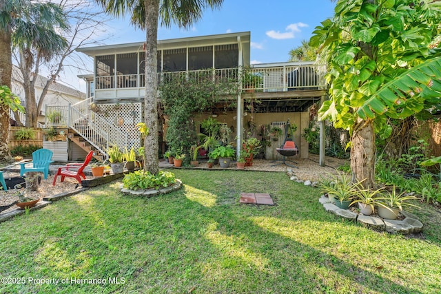 view of yard featuring a sunroom