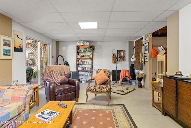 living room with a paneled ceiling