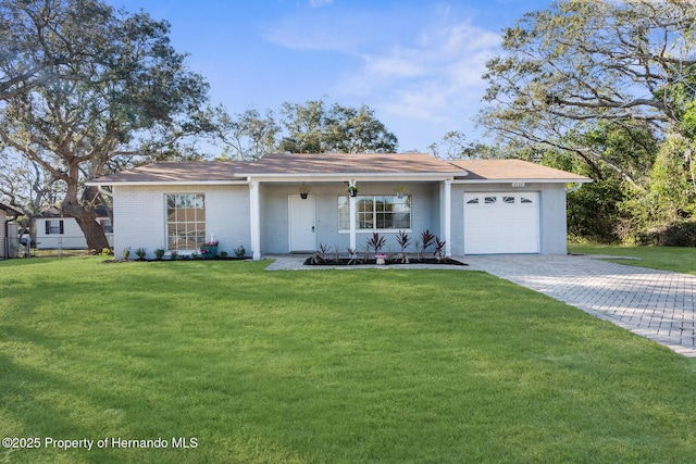 ranch-style home featuring a front lawn, a porch, and a garage