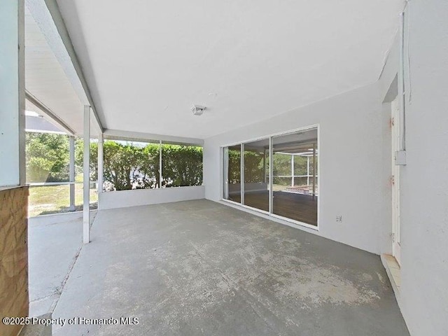 unfurnished sunroom with a wealth of natural light