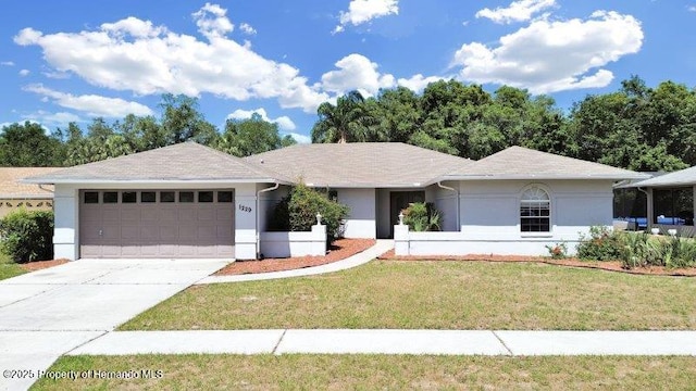 single story home with a garage and a front lawn