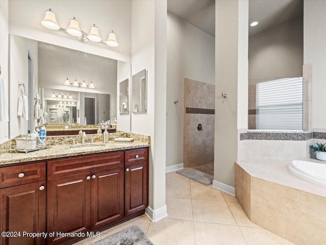 bathroom with vanity, tile patterned floors, and independent shower and bath