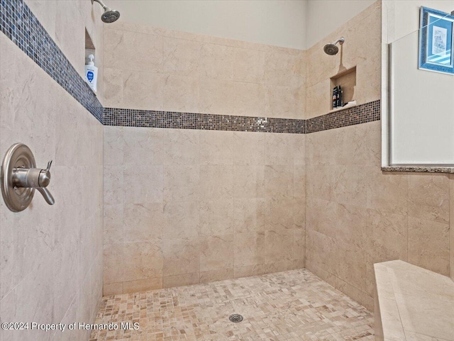 bathroom featuring tiled shower