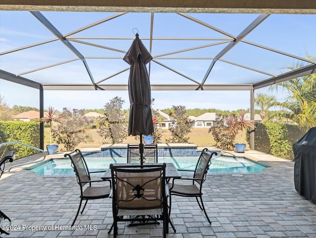 view of pool featuring a lanai and a patio