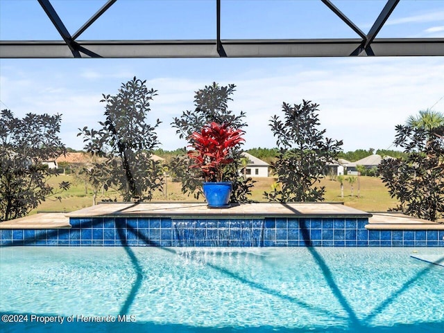 view of pool with a lanai