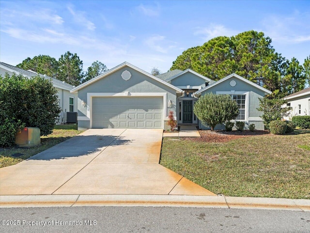 single story home with central AC unit, a garage, and a front yard