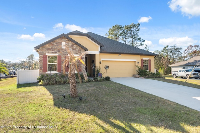 view of front facade with a front yard and a garage