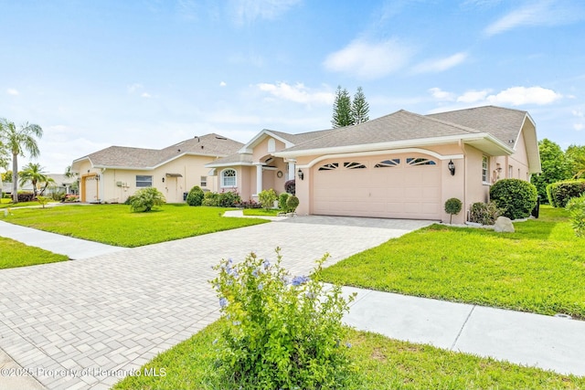 single story home with a front yard and a garage