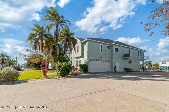 view of side of home with a garage