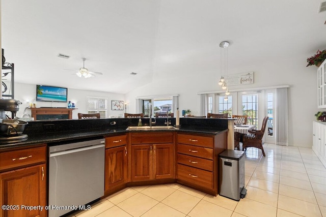 kitchen featuring light tile patterned flooring, stainless steel dishwasher, ceiling fan, and sink