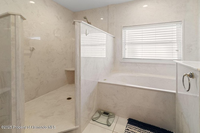 bathroom featuring tile patterned floors and plus walk in shower