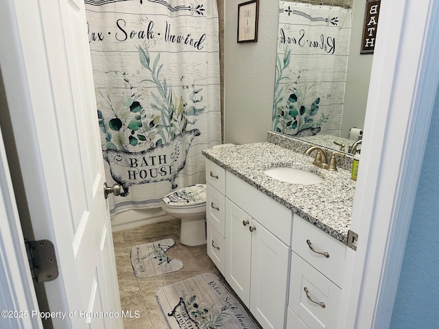 bathroom with vanity and toilet