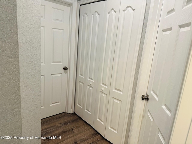 corridor featuring dark wood-type flooring