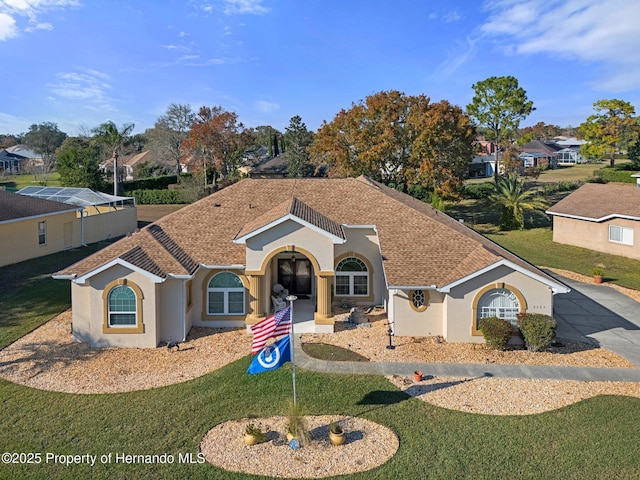 view of front of home featuring french doors and a front lawn