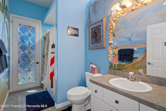 bathroom with toilet, tile patterned flooring, vanity, and a shower with curtain