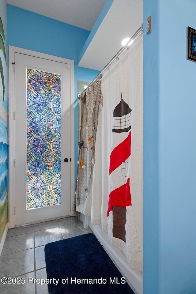 bathroom with tile patterned floors