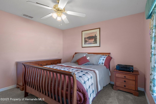 bedroom featuring ceiling fan and light carpet