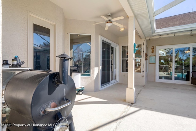 view of patio featuring ceiling fan