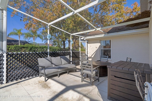 view of patio with a lanai and an outdoor living space