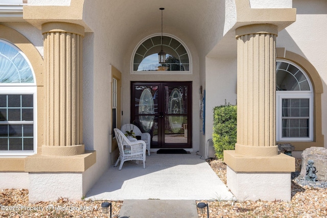 entrance to property featuring french doors