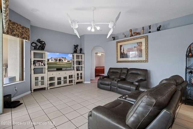 living room with ceiling fan and tile patterned floors