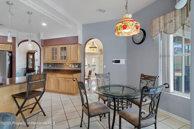 dining area featuring light tile patterned flooring