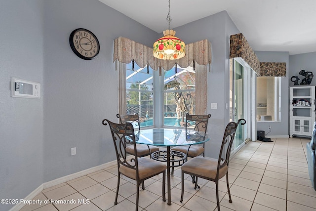 unfurnished dining area featuring light tile patterned floors