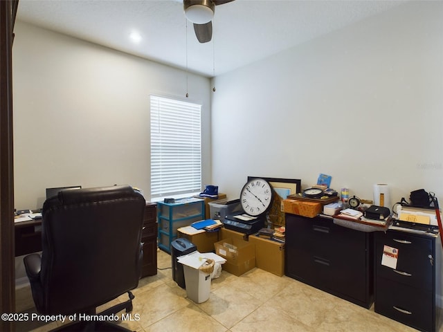 tiled home office featuring ceiling fan