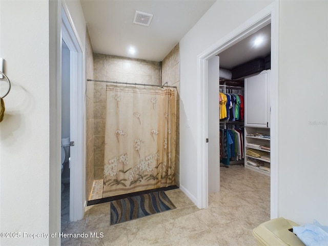 bathroom featuring walk in shower