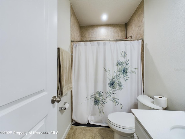 bathroom with toilet, vanity, and a shower with shower curtain