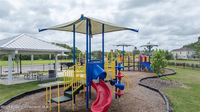 view of jungle gym with a gazebo and a lawn