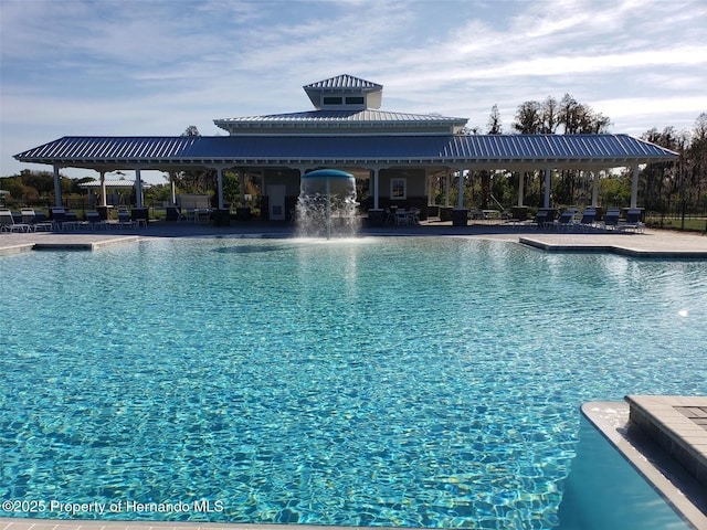 view of swimming pool featuring pool water feature