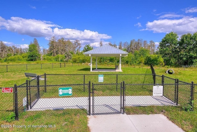 surrounding community with a gazebo and a yard