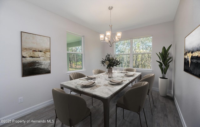 dining space featuring a chandelier and dark hardwood / wood-style floors