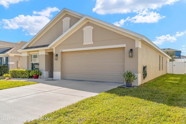 view of front of house featuring a front yard and a garage