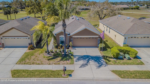 birds eye view of property with a residential view