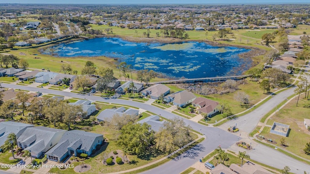 birds eye view of property featuring a residential view and a water view