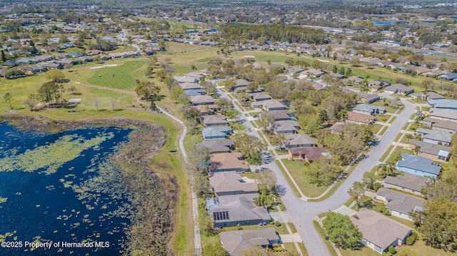 bird's eye view with a residential view and a water view