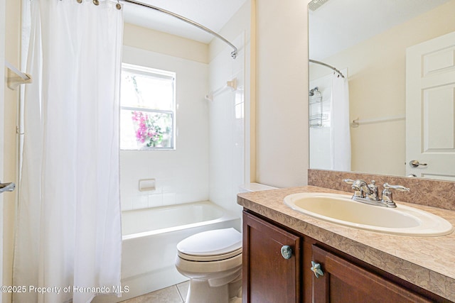 full bath featuring shower / tub combo, toilet, vanity, and tile patterned flooring