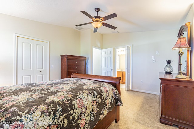 bedroom with visible vents, lofted ceiling, light colored carpet, and baseboards