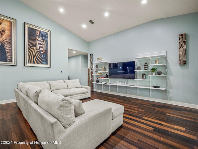 living room featuring dark hardwood / wood-style floors and lofted ceiling